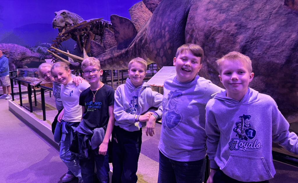 Kids at a museum exhibit, possibly related to admissions.